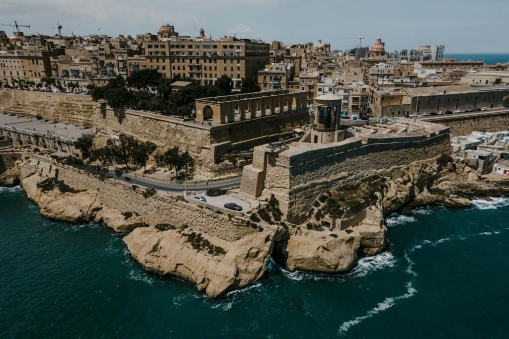 7 days in Malta itinerary featuring Valletta fortifications and limestone buildings overlooking turquoise Mediterranean waters