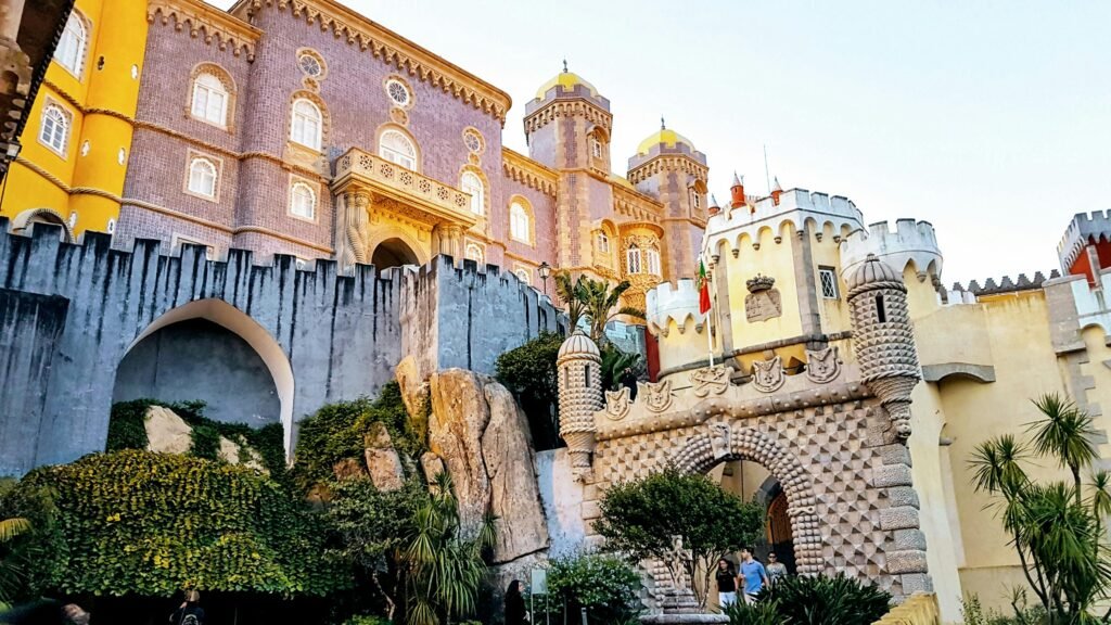 The stunning pink and yellow facade of Pena Palace in Sintra, an essential day trip during 7 days in Lisbon.