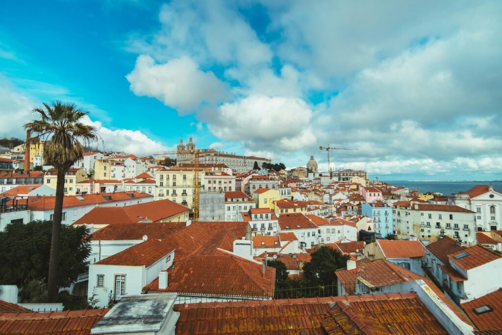 A dramatic coastline with cliffs and turquoise water, showcasing the beautiful day trips you can take during 7 days in Lisbon.